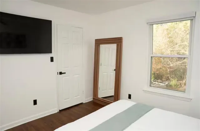 a bathroom with a tub and shower