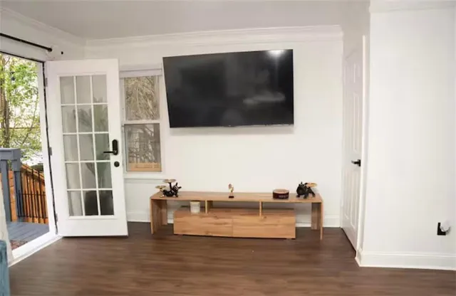 a view of living room with furniture and flat screen tv