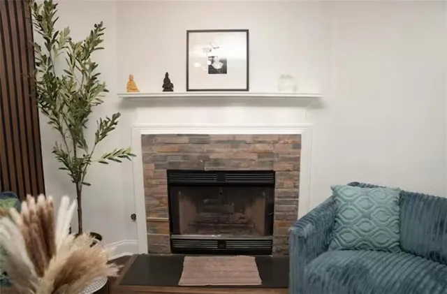 a living room with furniture and a fireplace