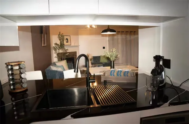 a close view of a refrigerator in kitchen and wooden floor