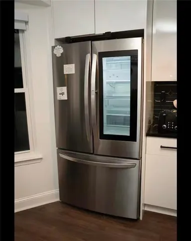 a stove top oven sitting inside of a kitchen