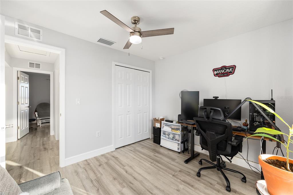 3597 Southwest 151st Avenue Ocala, FL 34481 - Photo 23 of 35 a view of workspace with wooden floor and gym equipment