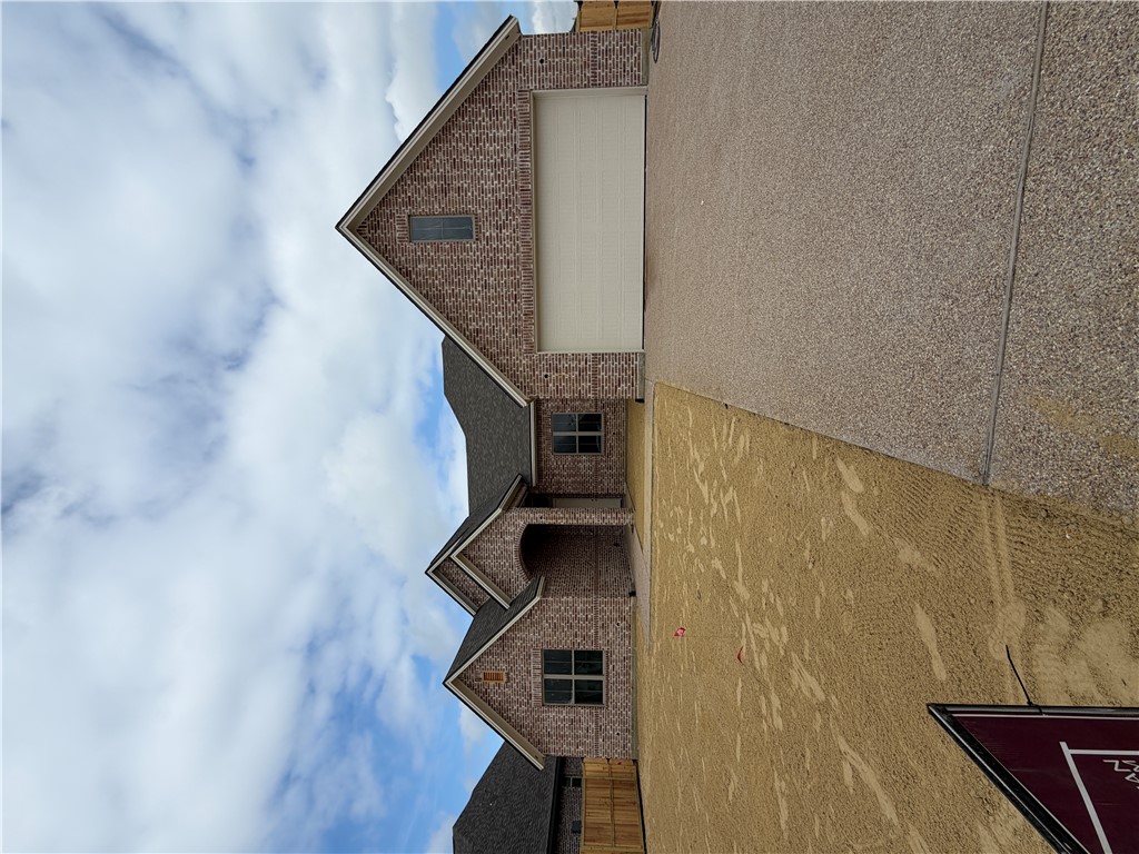 a front view of a house with yard