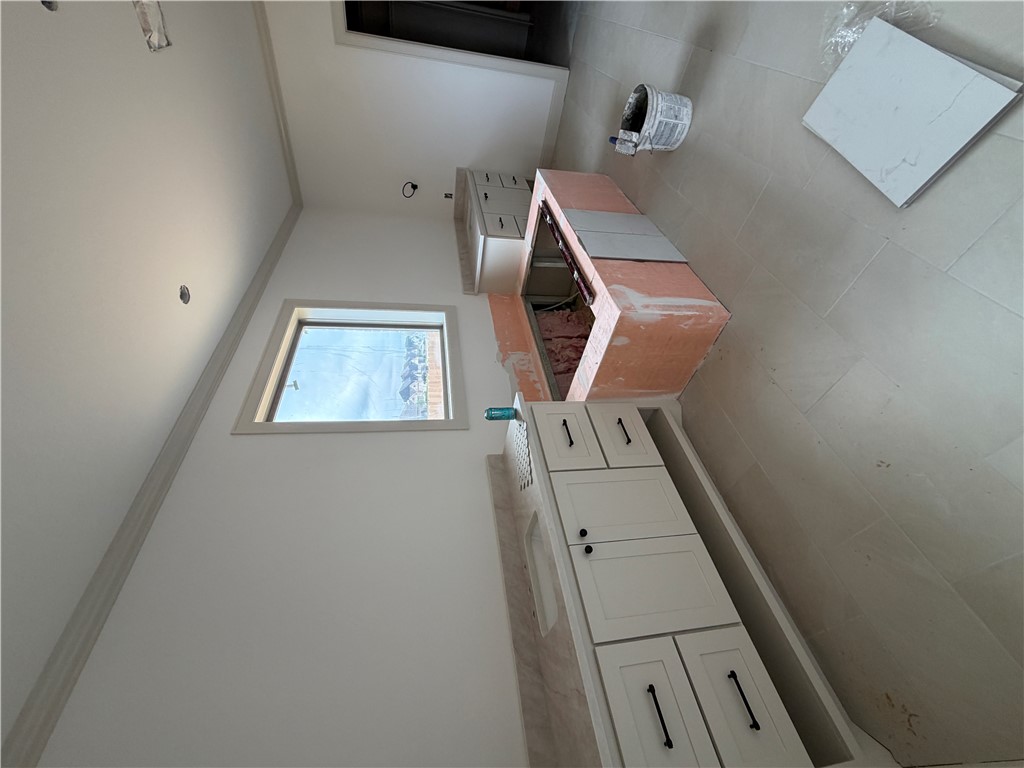 5107 Greenstone Way Bryan, TX 77802 - Photo 12 of 22 a view of a kitchen with stainless steel appliances cabinets and couch