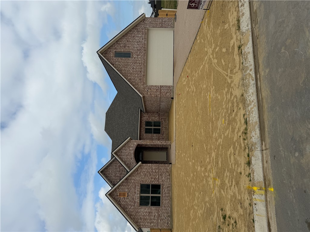 5107 Greenstone Way Bryan, TX 77802 - Photo 2 of 22 a front view of a house with a yard