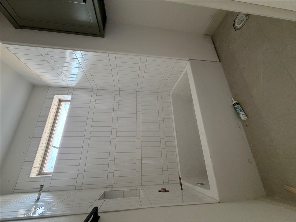 5107 Greenstone Way Bryan, TX 77802 - Photo 22 of 22 a bathroom with a bathtub