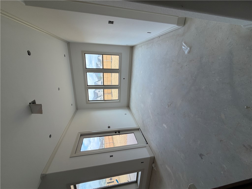 5107 Greenstone Way Bryan, TX 77802 - Photo 8 of 22 an empty room with a empty space and windows