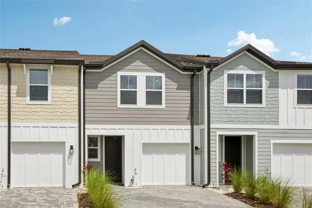 a front view of a house with yard