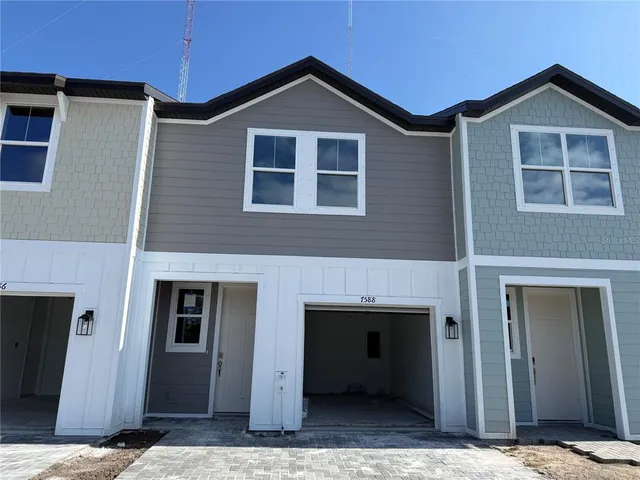 a front view of a house with garage