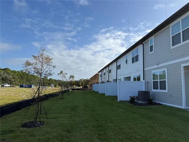 a view of a road with a building in the background