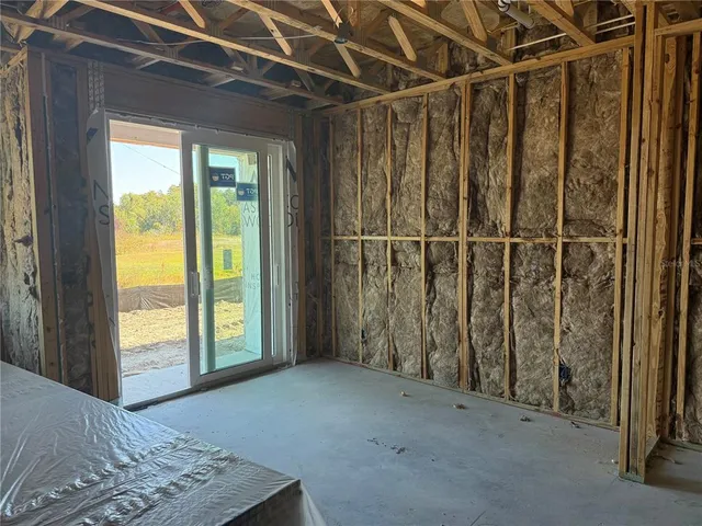 a view of a hallway with wooden shelves