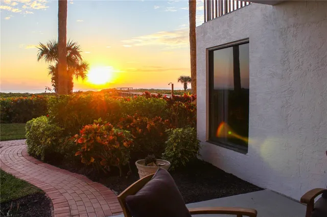 a sign that is sitting in front of a house