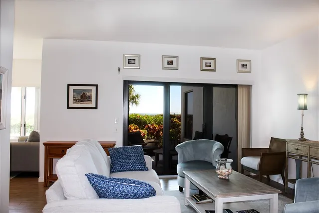 a living room with furniture and a lamp