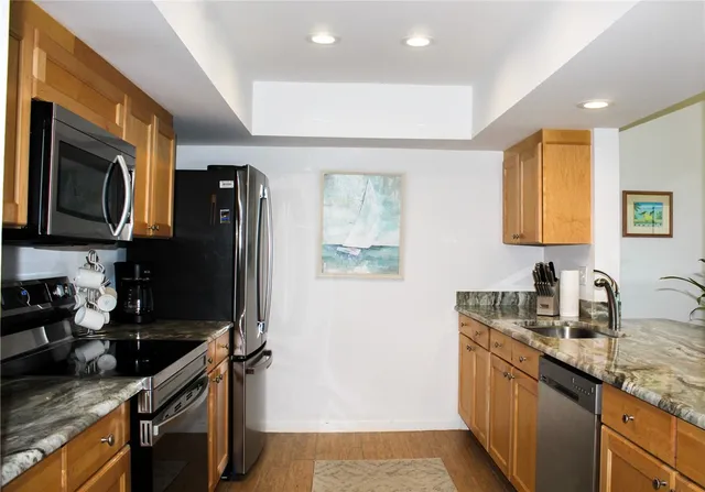 a swimming pool with outdoor seating and a garden