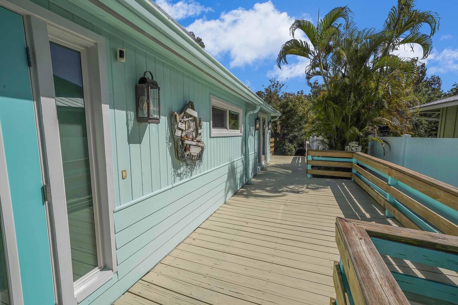 925 Southwest Rustic Circle Stuart, FL 34997 - Photo 14 of 43 Deck to front entrance of home