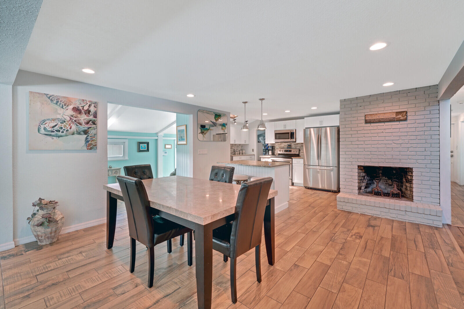 925 Southwest Rustic Circle Stuart, FL 34997 - Photo 24 of 43 Dining/Kitchen and fireplace