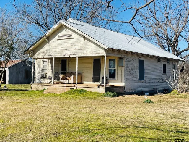 a room with a table and chairs