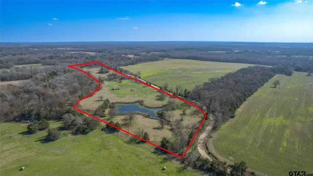 a view of a lake with trees