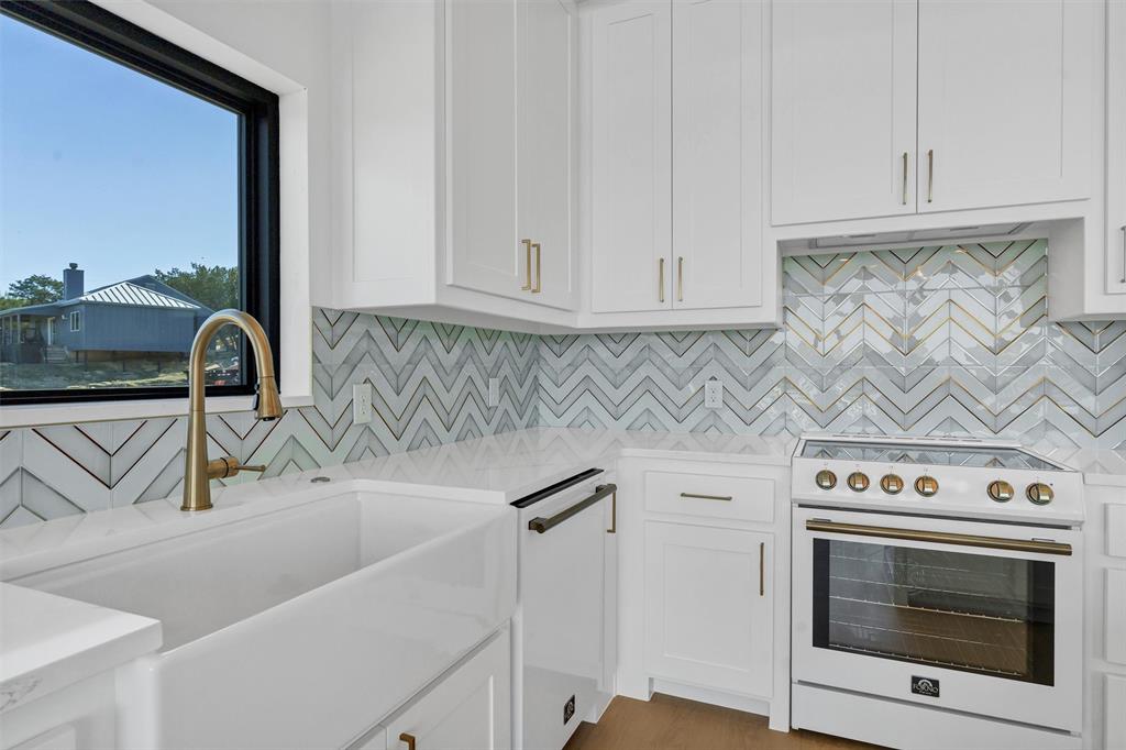 1782 Fm 2951, Unit 28 Graford, TX 76449 - Photo 16 of 30 a kitchen with a sink and cabinets