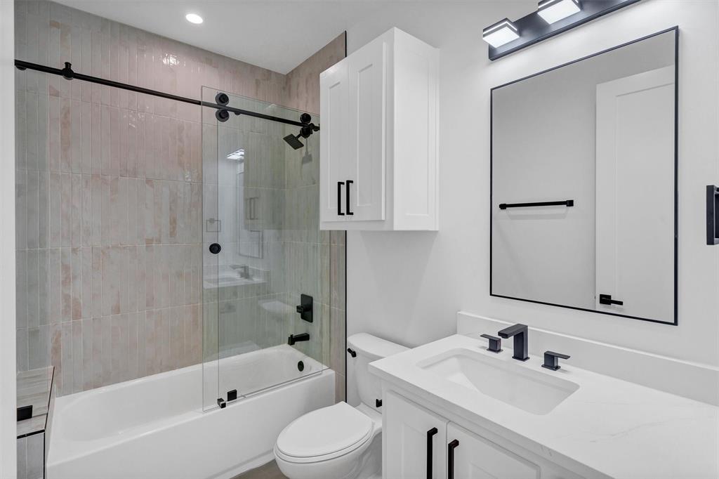 1782 Fm 2951, Unit 28 Graford, TX 76449 - Photo 21 of 30 a bathroom with a sink toilet tub and shower