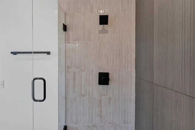 a bathroom with a double vanity sink a toilet and a mirror