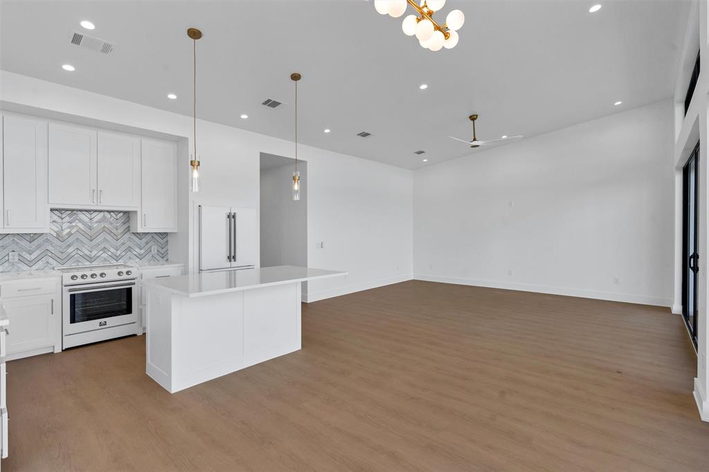 1782 Fm 2951, Unit 28 Graford, TX 76449 - Photo 9 of 30 a view of kitchen and kitchen with granite countertop stove top oven