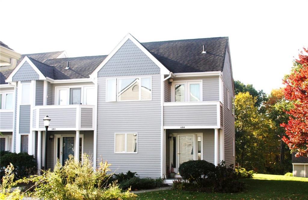 59 Old Post Road, Unit AR4 Clinton, CT 06413 - Photo 1 of 1 a front view of a house with garden