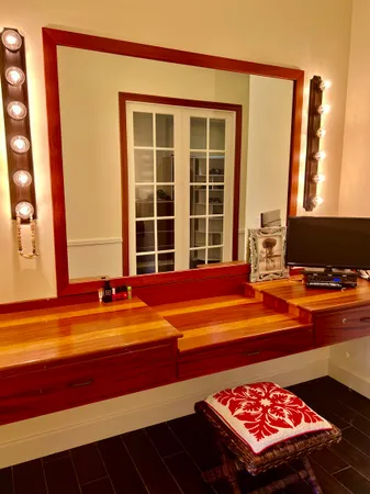 a living room with a rug and a table