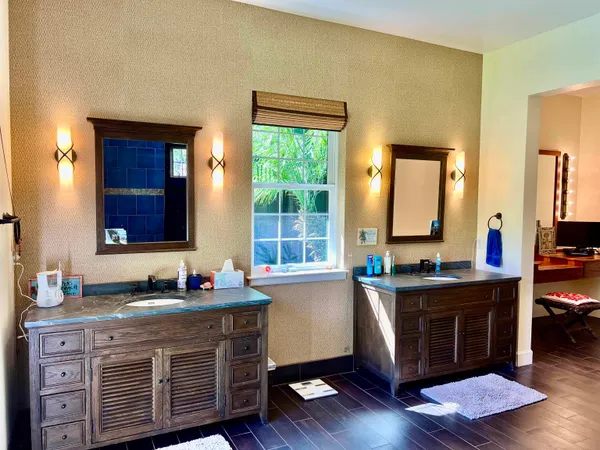 a kitchen with sink cabinets and wooden floor
