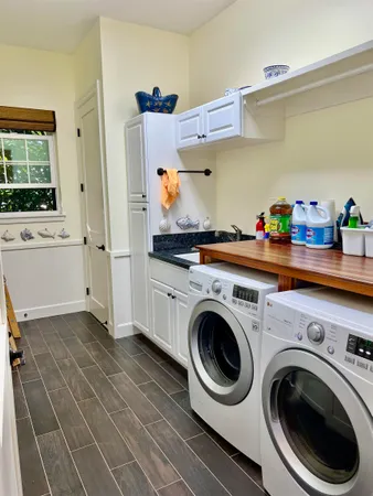 a bedroom with bed and a window