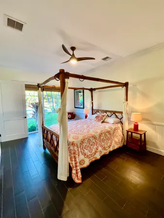 a bed room with a bed window and television