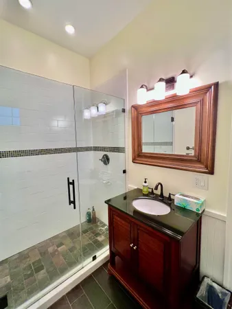 a bedroom with a bed window and a table