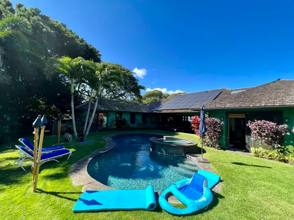 a view of swimming pool with a yard