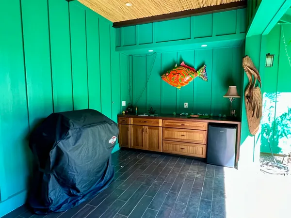 a outdoor dining space with furniture and outdoor view