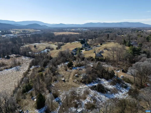 an aerial view of residential house and green space