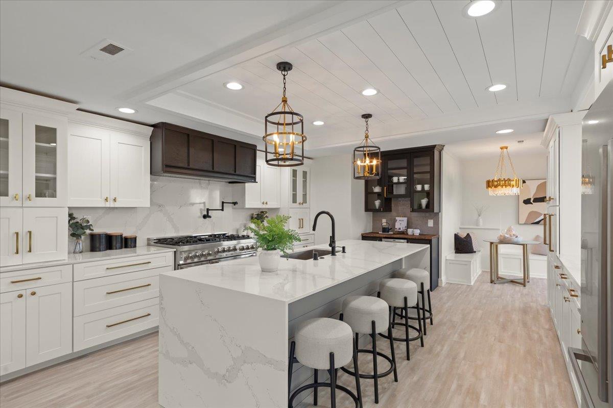 2915 Thomas Grde Morgan Hill, CA 95037 - Photo 14 of 87 a kitchen with stainless steel appliances kitchen island granite countertop a sink and cabinets