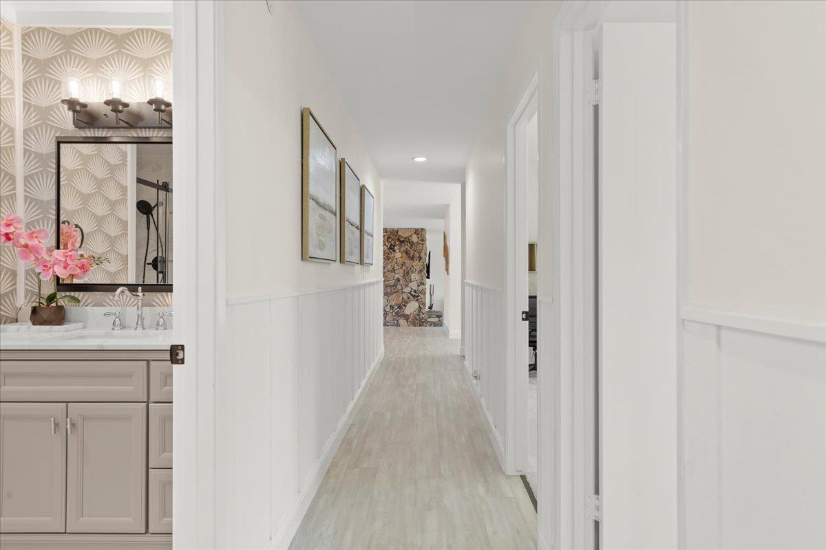 2915 Thomas Grde Morgan Hill, CA 95037 - Photo 21 of 87 a view of a hallway with paintings on the wall