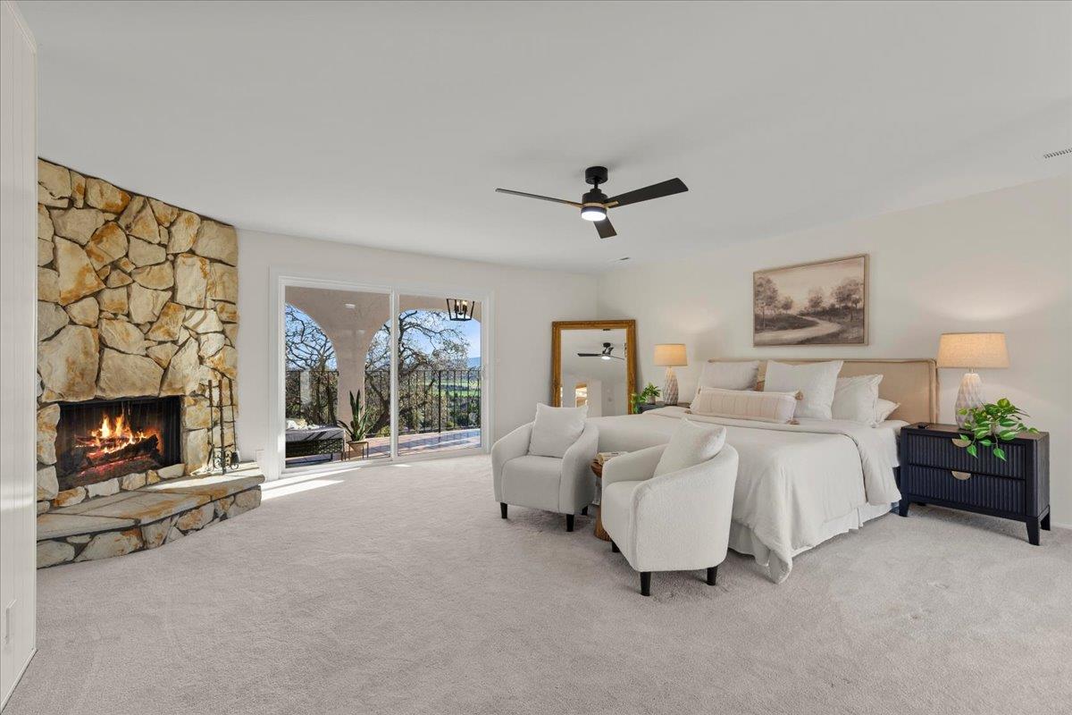 2915 Thomas Grde Morgan Hill, CA 95037 - Photo 22 of 87 a spacious bedroom with a bed and a fireplace