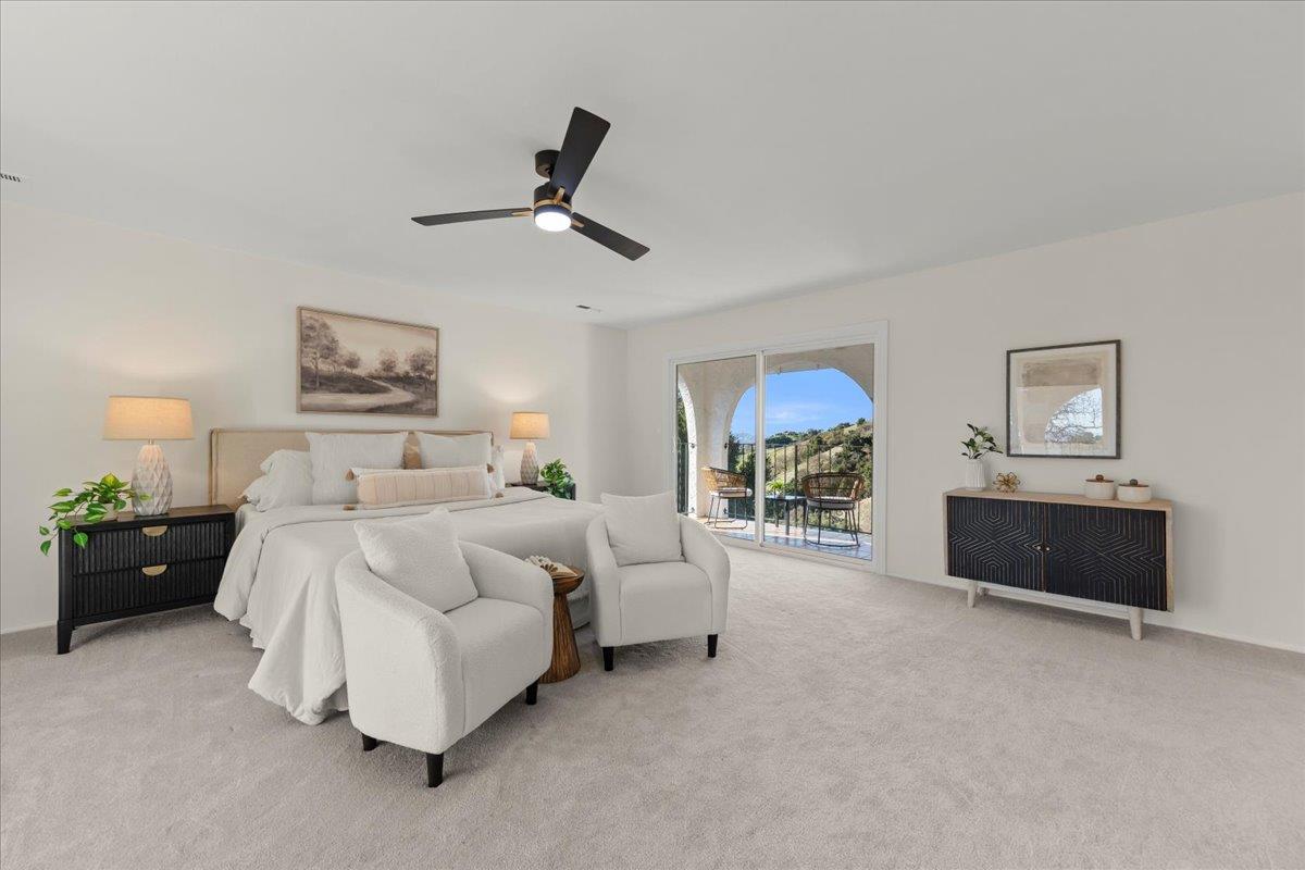 2915 Thomas Grde Morgan Hill, CA 95037 - Photo 23 of 87 a spacious bedroom with a bed and a chandelier