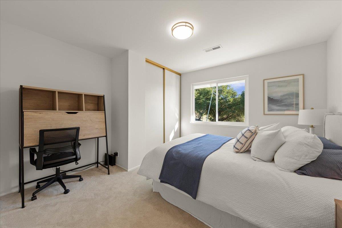2915 Thomas Grde Morgan Hill, CA 95037 - Photo 36 of 87 a bedroom with a bed a table and painting