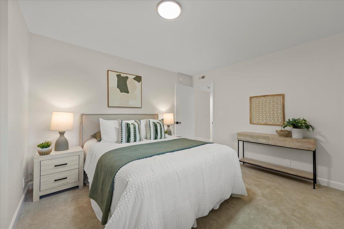 2915 Thomas Grde Morgan Hill, CA 95037 - Photo 48 of 87 a spacious bedroom with a bed and a lamp