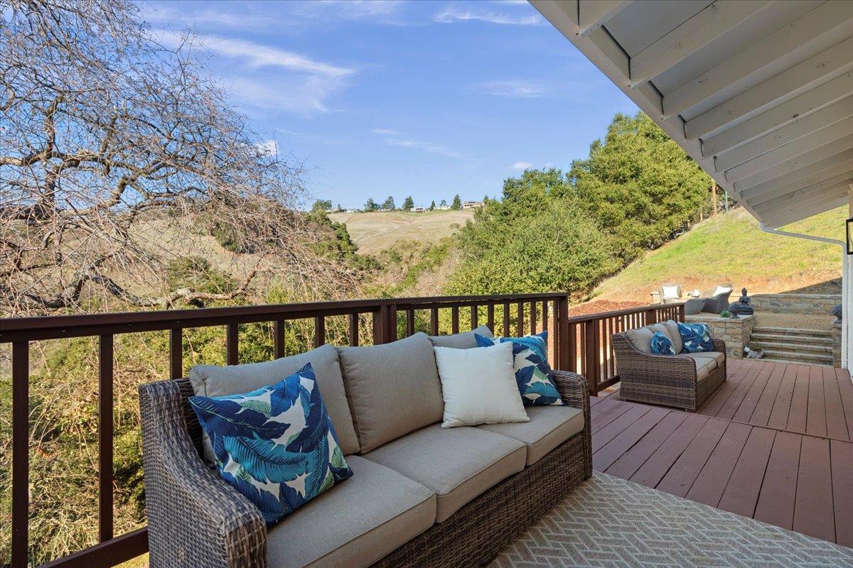 2915 Thomas Grde Morgan Hill, CA 95037 - Photo 64 of 87 a balcony with wooden floor and outdoor seating