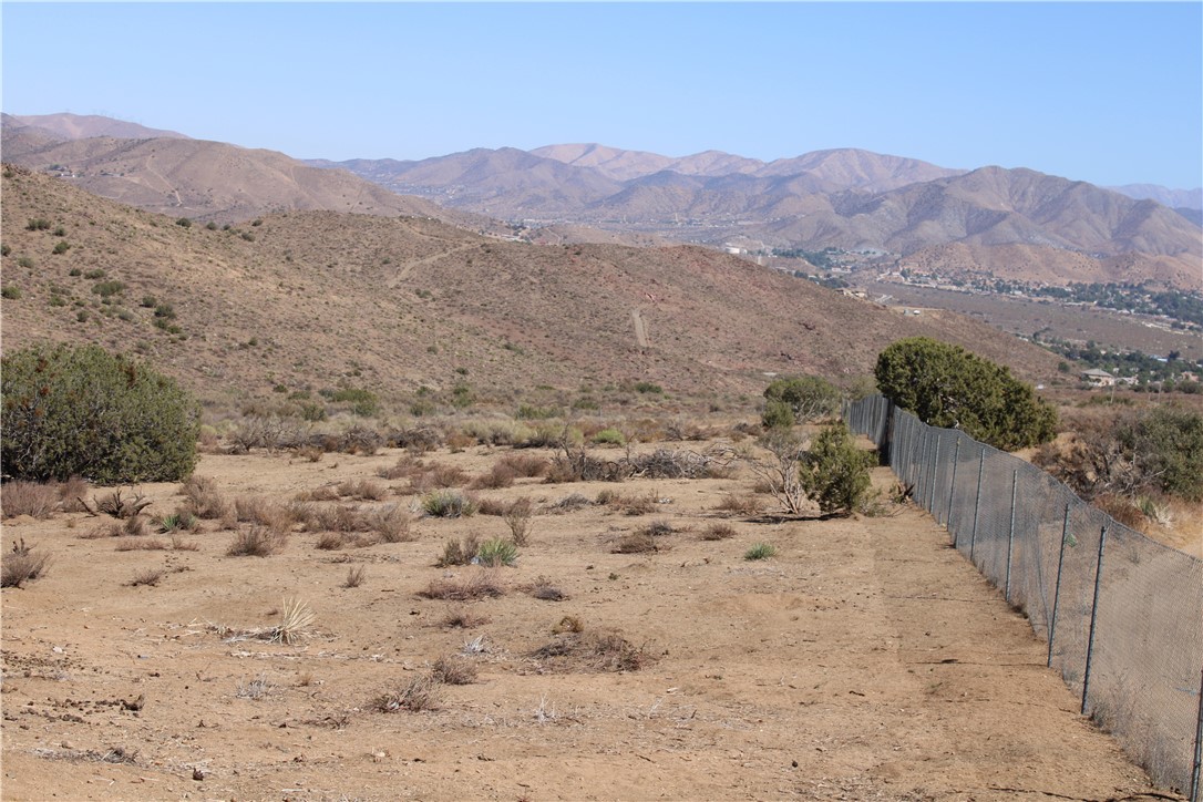 4570 Hubbard Road Acton, CA 93510 - Photo 5 of 11 a view of a dry field with a mountain in the background