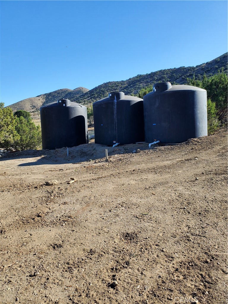 4570 Hubbard Road Acton, CA 93510 - Photo 8 of 11 a view of a house with a field