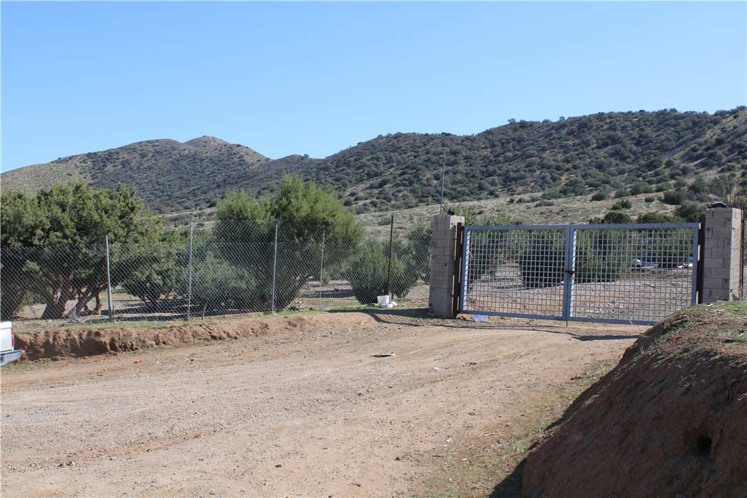 4570 Hubbard Road Acton, CA 93510 - Photo 10 of 11 a backyard of a house with large trees