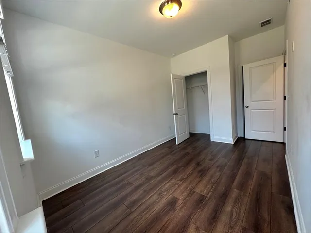 a view of kitchen with furniture and stainless steel appliances