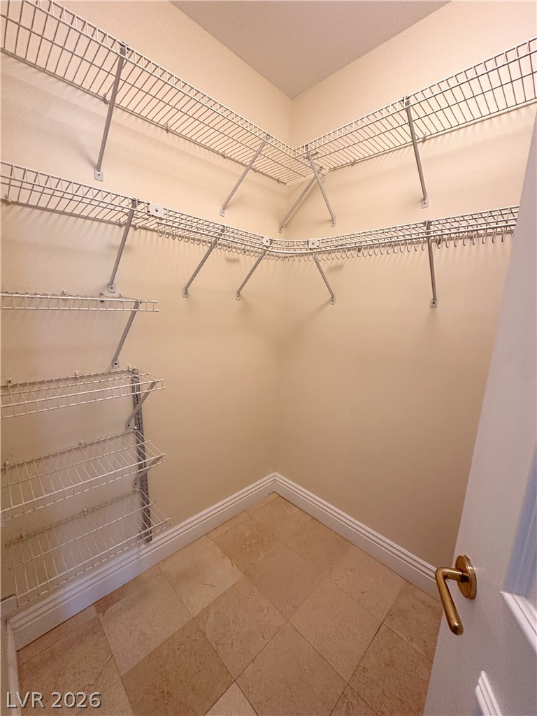 2747 Paradise Road, Unit 1706 Las Vegas, NV 89109 - Photo 21 of 35 Ample wire shelving provides generous storage in this walk-in closet.