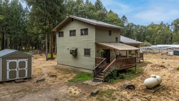 a house with trees in the background