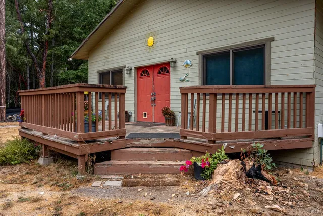 a backyard of a house with a bench