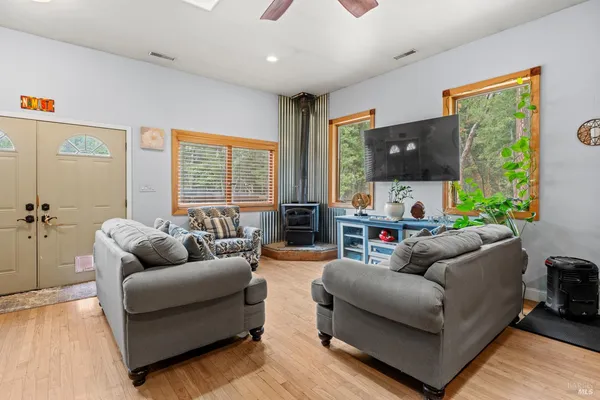a living room with furniture and a flat screen tv
